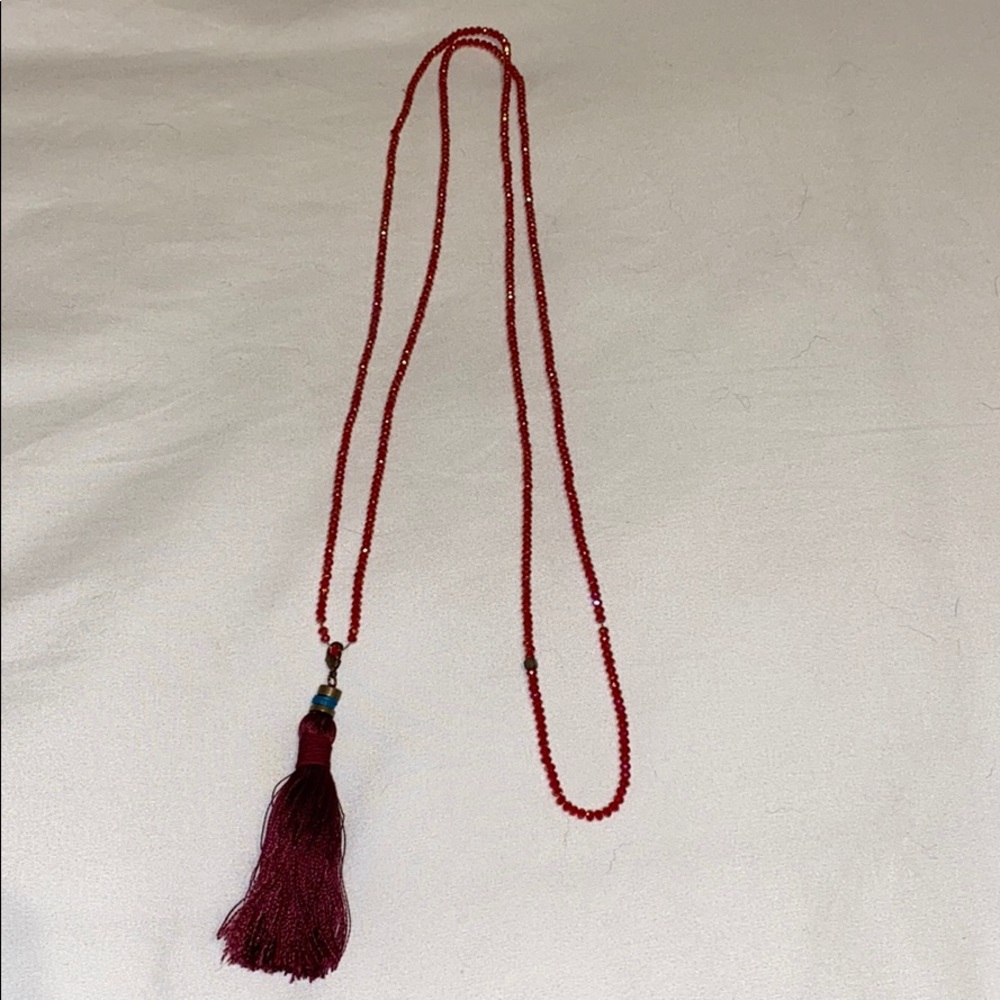 Red beaded necklace with red/ maroon tassel
